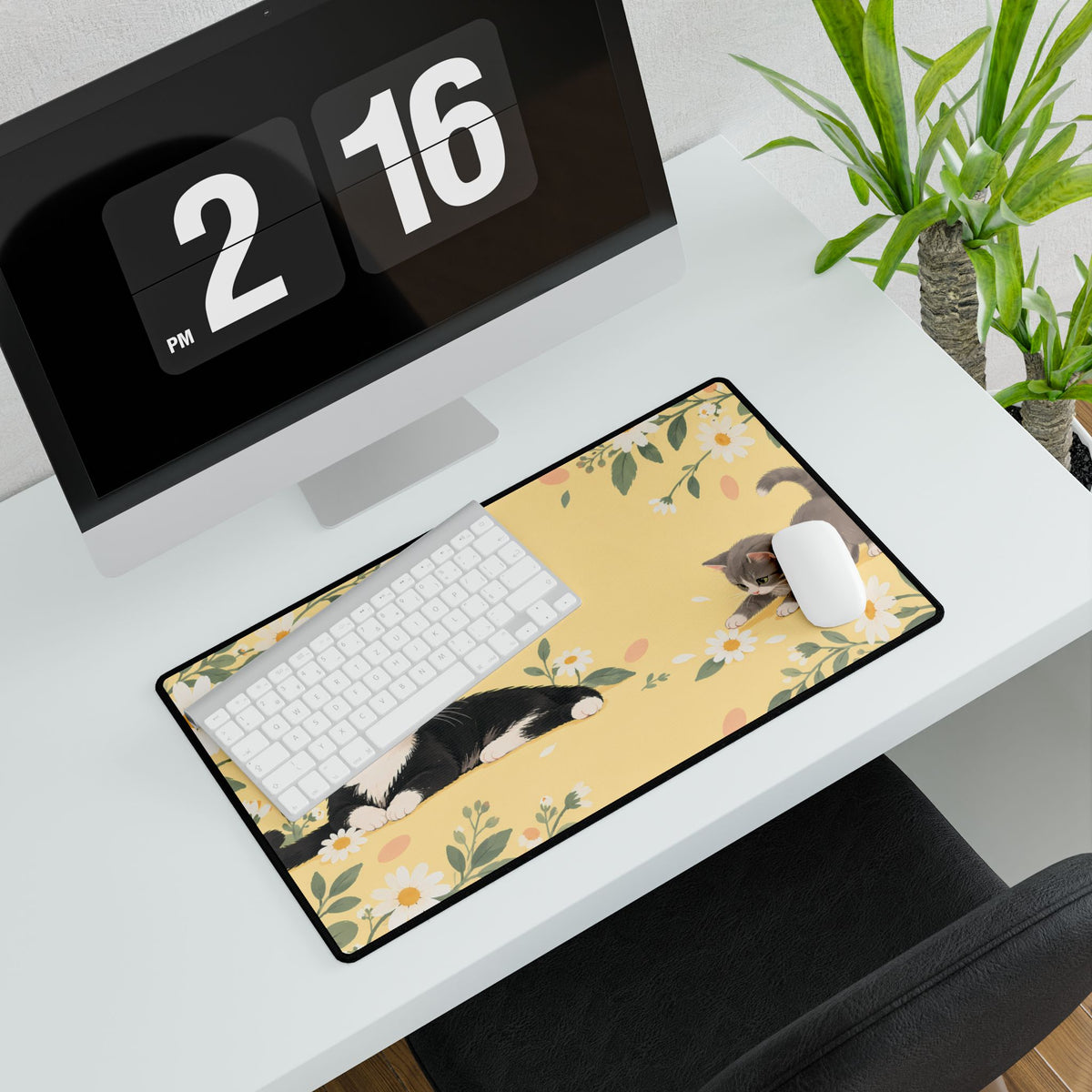 Daisy Cats Desk Mat, 23.6 × 13.8 in, angled computer desk mockup with plant.