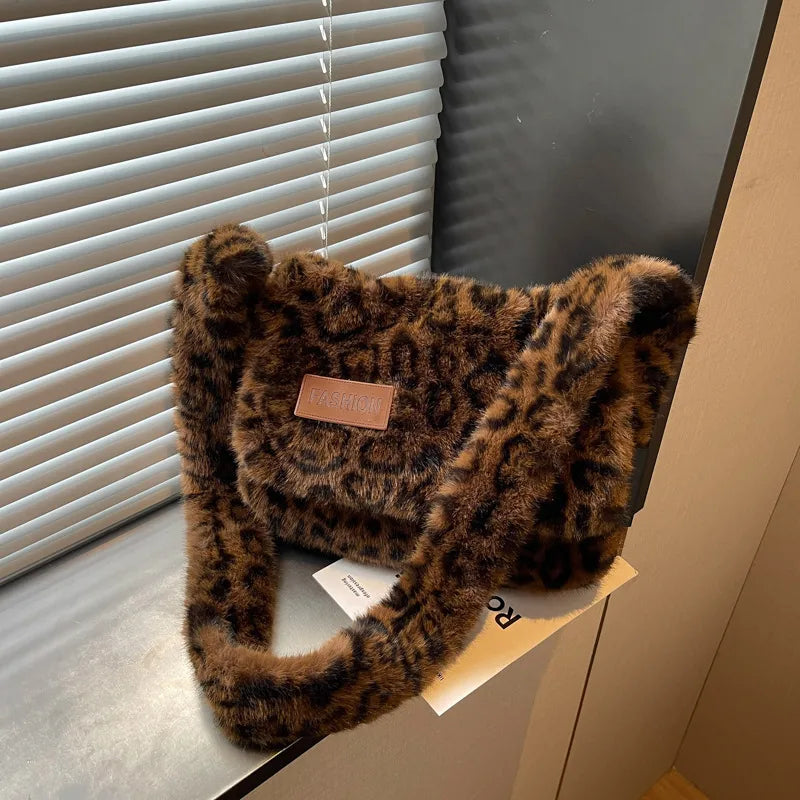 Leopard-print plush shoulder bag — dark brown leopard print on table | BTendance