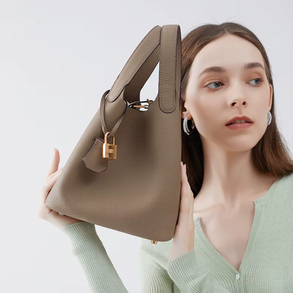 Soft Bucket Handbag – Twin Handles and Gold-Tone Detail — Brown, handle and hardware close-up | BTendance