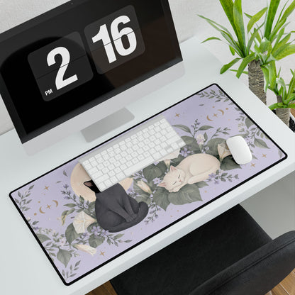 Moonflower Cats Desk Mat, 31.5 × 15.5 in, angled computer desk mockup with plant.