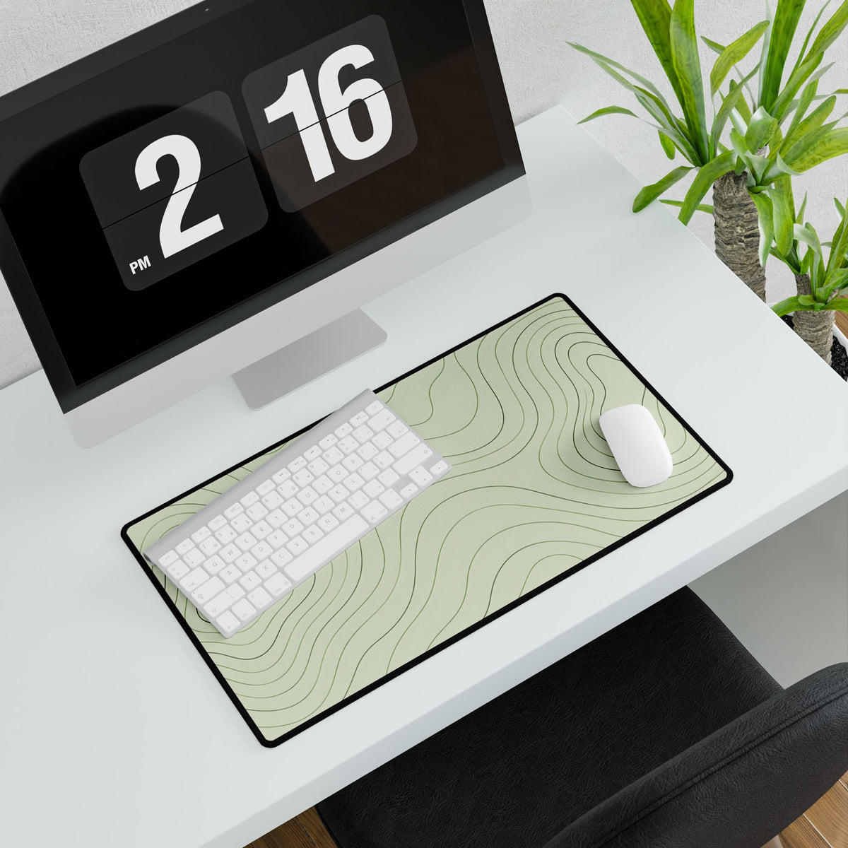 Sage Green Topographic Desk Mat, 23.6 × 13.8 in, angled computer desk mockup with plant.