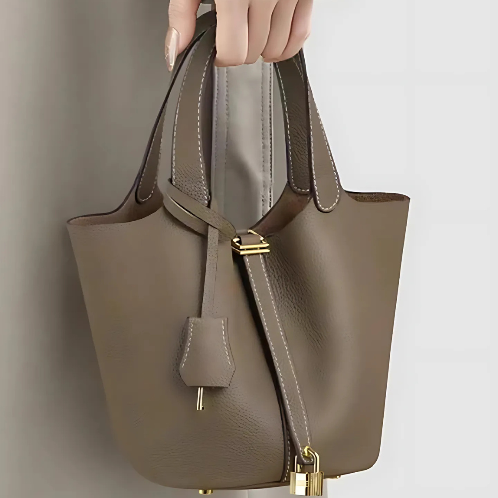 Soft Bucket Handbag – Twin Handles and Gold-Tone Detail — Brown, hand-held front detail | BTendance