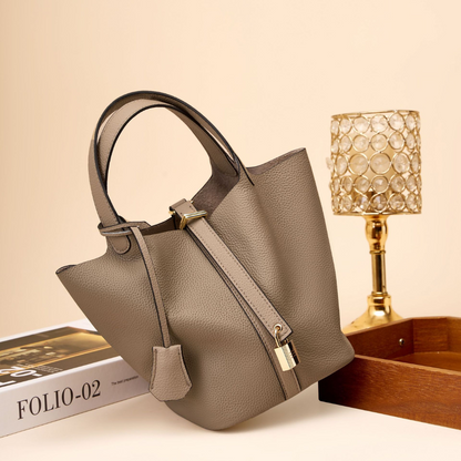 Soft Bucket Handbag – Twin Handles and Gold-Tone Detail — Brown, angled tabletop view | BTendance