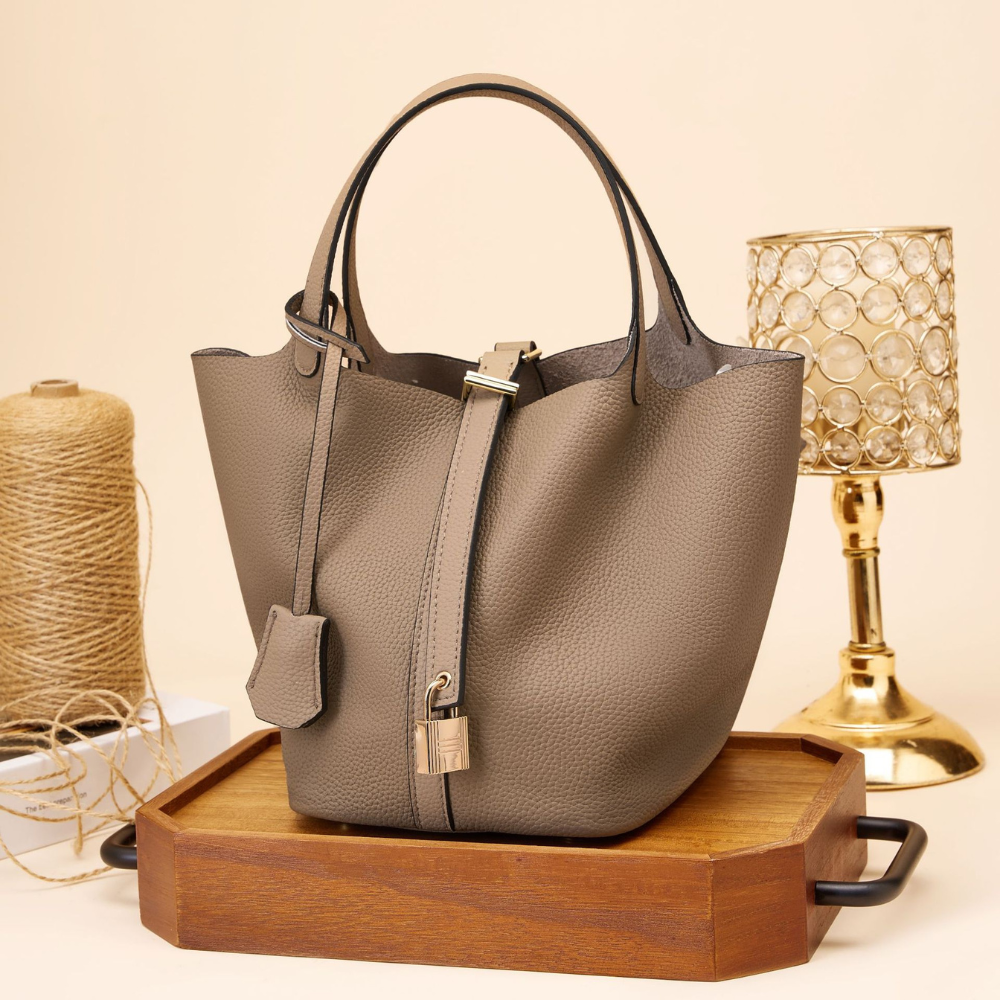 Soft Bucket Handbag – Twin Handles and Gold-Tone Detail — Brown, front on wooden tray | BTendance
