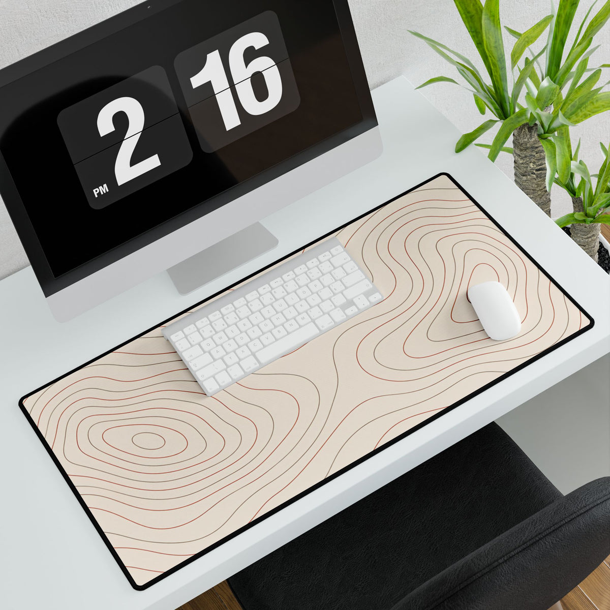 Terracotta Topographic Desk Mat, 31.5 × 15.5 in, angled computer desk mockup with plant.