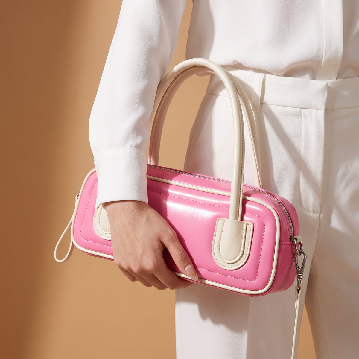 Retro Bowling Crossbody Bag – Camila Contrast Piping — Pink, hand carrying for scale | BTendance