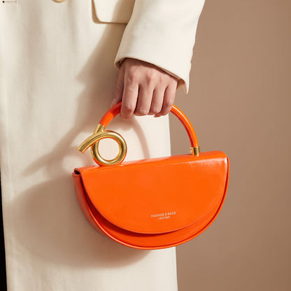 Vegan Leather Half-Moon Bag – Valeria Crossbody Strap — Orange, loop handle close-up | BTendance