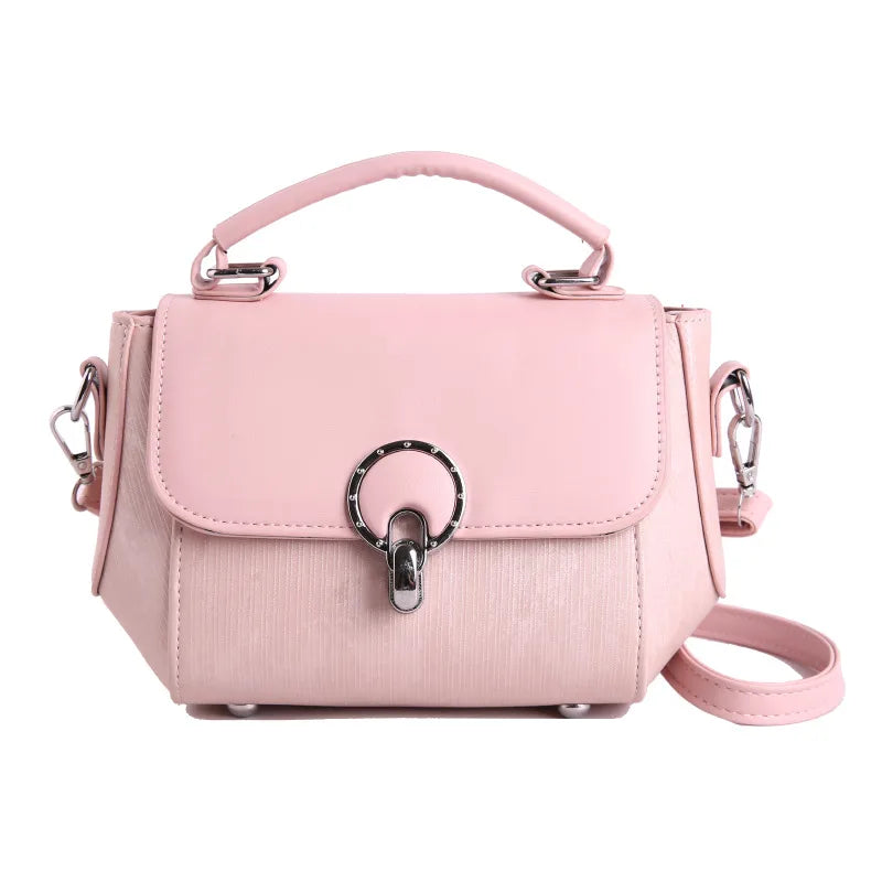 Ring clasp top handle crossbody bag – Pink bag with shoulder strap, front view | BTendance