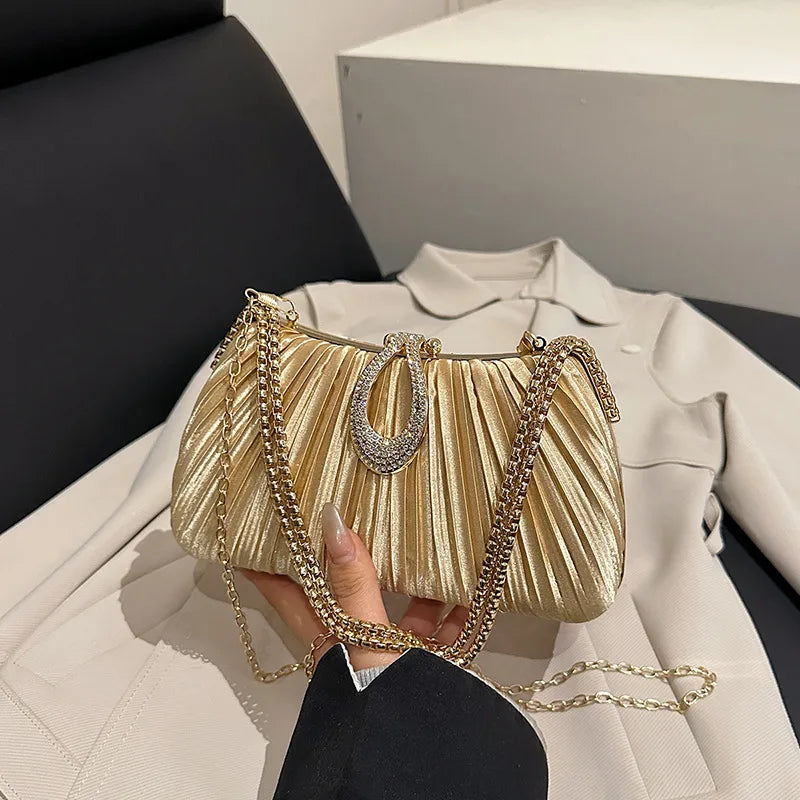 Pleated Evening Bag with Rhinestone Loop Detail – Gold held for scale | BTendance