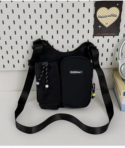 Crossbody bag with mesh bottle pocket and front zip pouch — black on display | BTendance