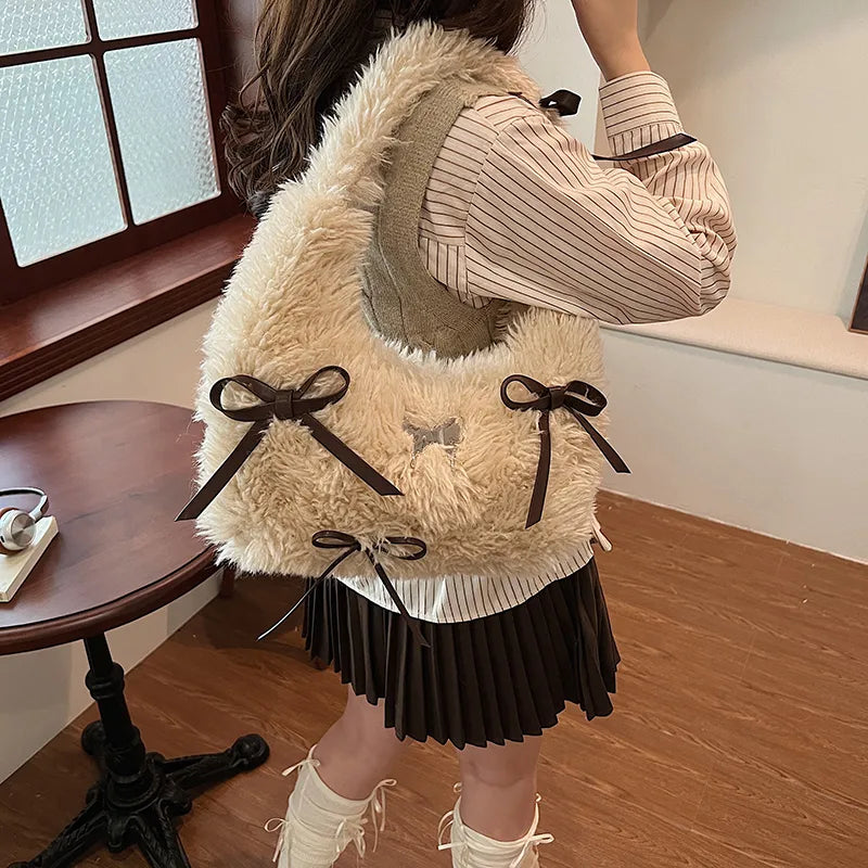 Shaggy plush shoulder bag with ribbon bows — cream worn on shoulder | BTendance