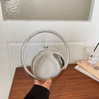 Round Acrylic Orb Bag with Faceted Ring Handle – Silver held for scale | BTendance