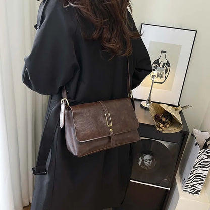 Rectangular flap shoulder bag with slim metal front detail — brown worn crossbody | BTendance