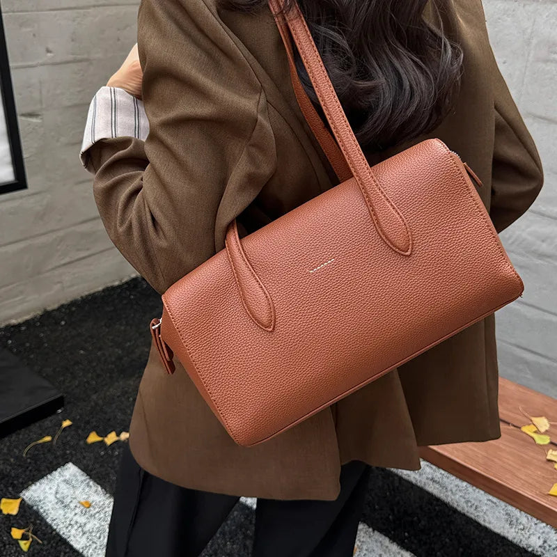 Rectangular shoulder bag with long twin handles — rust worn on shoulder | BTendance
