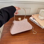 Women's Textured Evening Bag with Pearl-Effect Clasp – Pink held for scale | BTendance