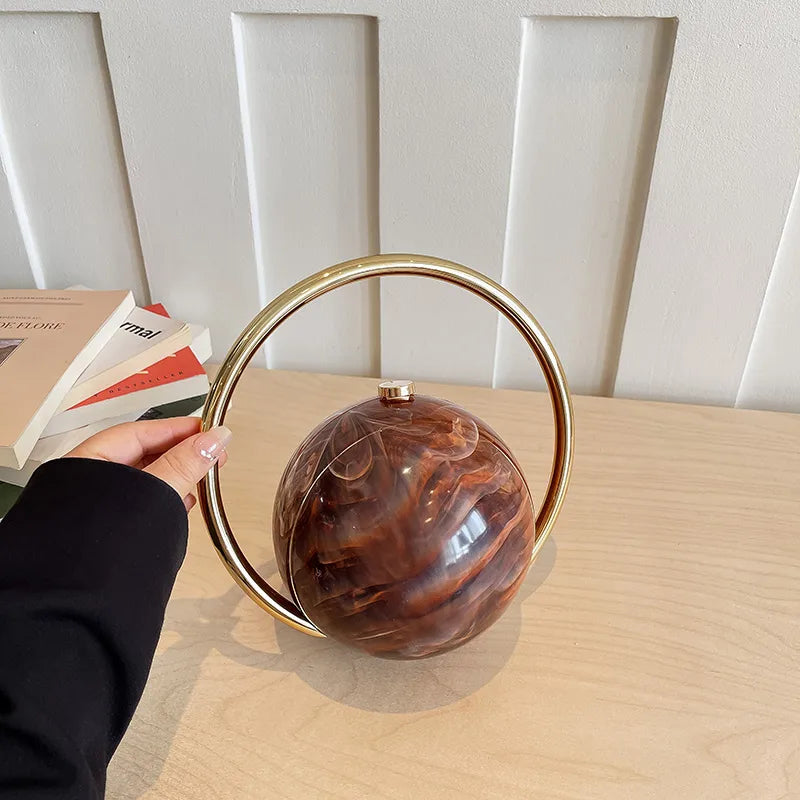Round Acrylic Orb Bag with Faceted Ring Handle – Coffee carried by handle | BTendance