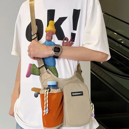 Crossbody bag with mesh bottle pocket and front zip pouch — beige with orange pocket worn crossbody | BTendance