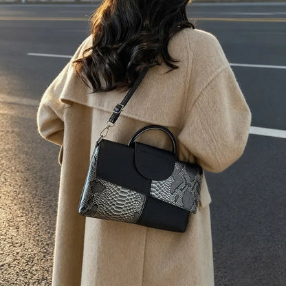 Structured handbag with contrasting reptile-texture panels — black and grey worn crossbody | BTendance