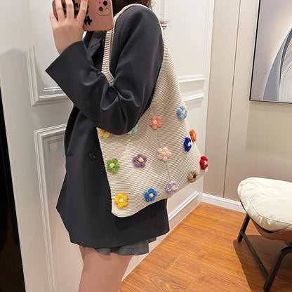 Flower applique knit shoulder tote – Multicolour flower tote worn with a dark jacket | BTendance