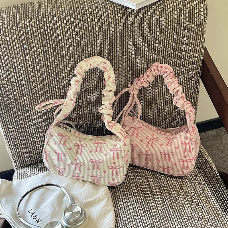 Bow-print corduroy shoulder bag with gathered handle — cream and pink displayed together | BTendance