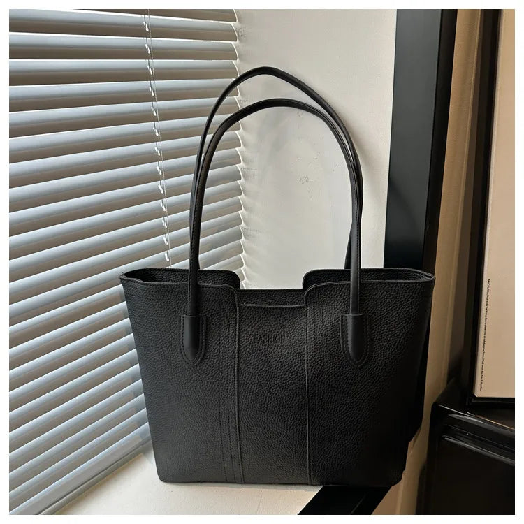 Structured tote bag with long handles – Black bag beside a window | BTendance