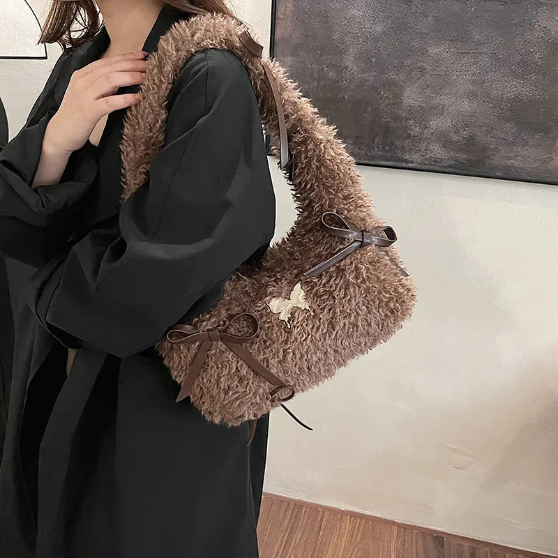 Shaggy plush shoulder bag with ribbon bows — brown worn on shoulder | BTendance