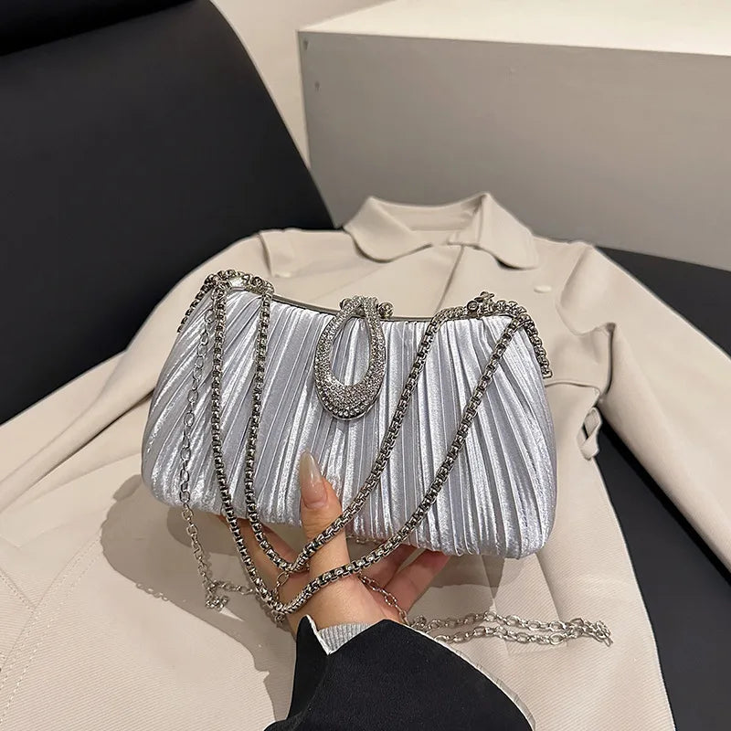 Pleated Evening Bag with Rhinestone Loop Detail – Silver held for scale | BTendance
