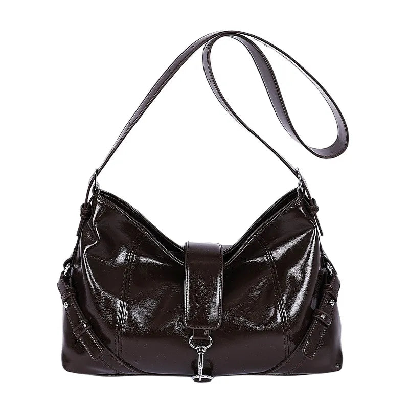 Glossy shoulder bag with central strap and metal clip — brown on white background | BTendance