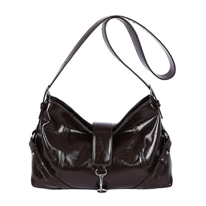 Glossy shoulder bag with central strap and metal clip — brown on white background | BTendance