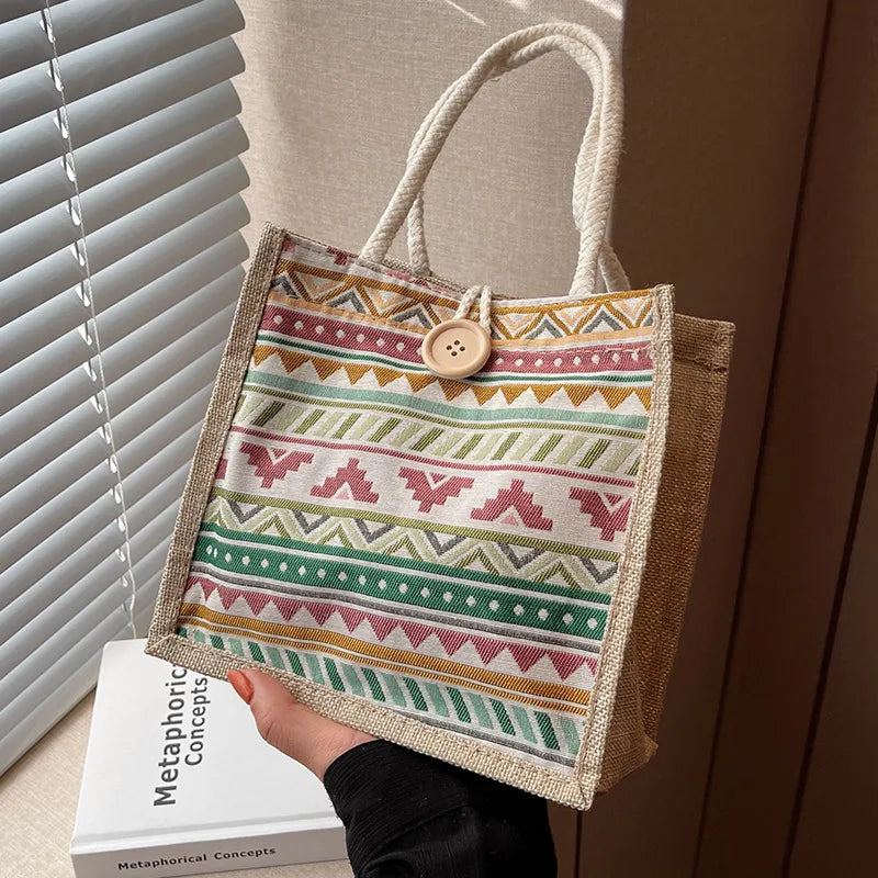 Geometric patterned tote with rope handles – Front view of tote held beside a window | BTendance