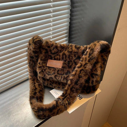 Leopard-print plush shoulder bag — dark brown leopard print on table | BTendance