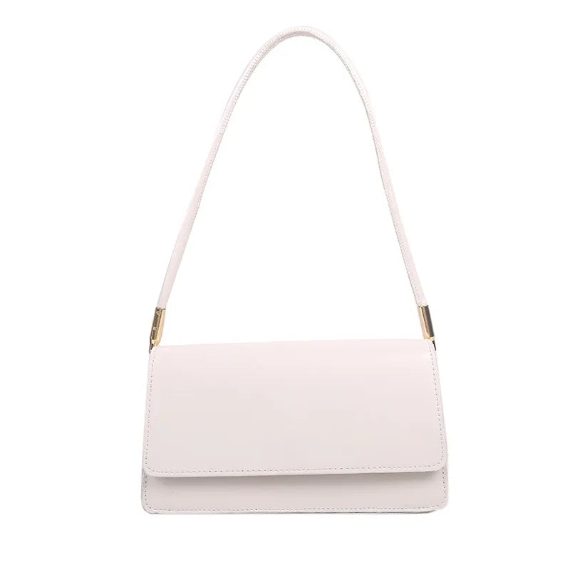 Slim rectangular flap shoulder bag with gold-tone strap accents — pale pink on white background | BTendance
