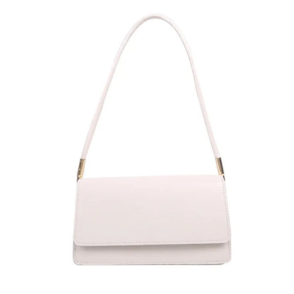 Slim rectangular flap shoulder bag with gold-tone strap accents — pale pink on white background | BTendance