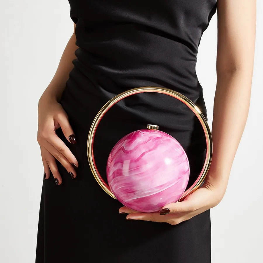 Marbled Globe Evening Bag with Orbit Handle – Rose red carried by handle | BTendance