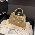 Women's Diagonal Rhinestone Top Handle Evening Bag – Gold held for scale | BTendance