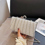 Women's Pearl-Effect Striped Evening Clutch – Silver held for scale | BTendance