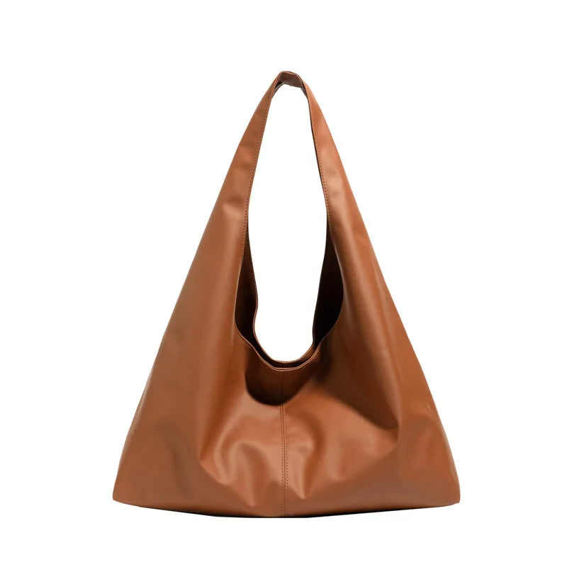 Slouchy shoulder tote with wide integrated strap — tan on white background | BTendance