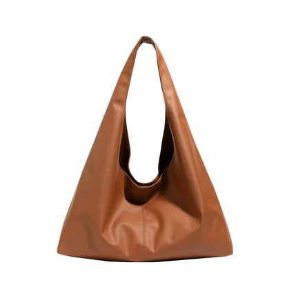 Slouchy shoulder tote with wide integrated strap — tan on white background | BTendance