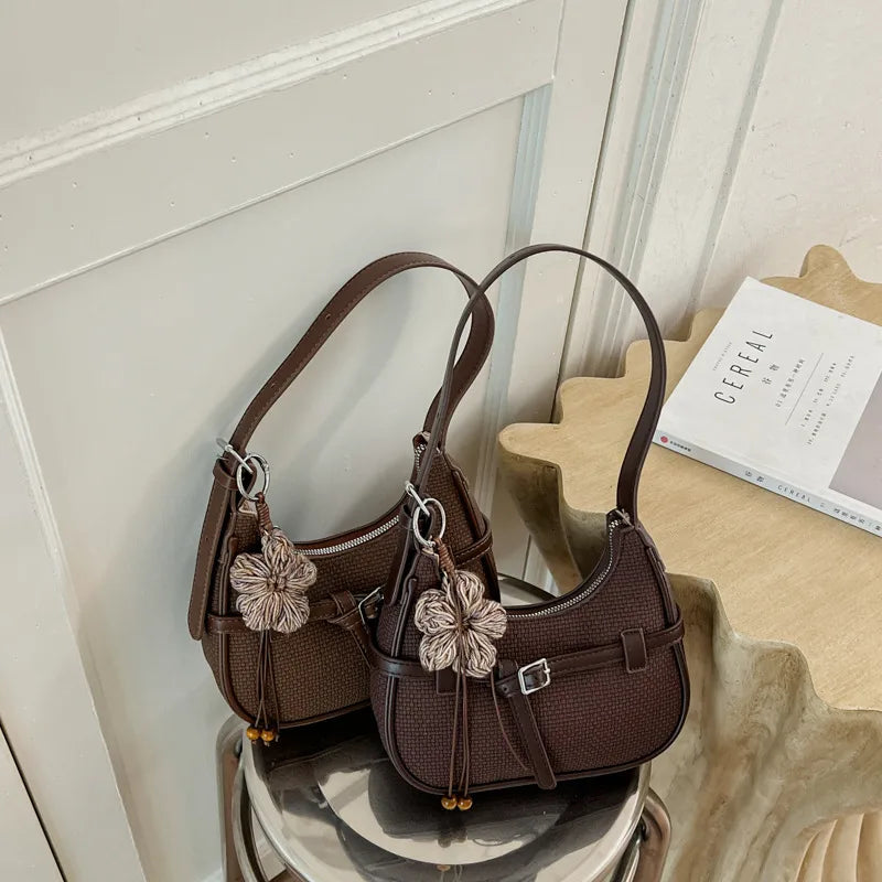 Buckle shoulder bag with floral charm – Two brown bags displayed together | BTendance