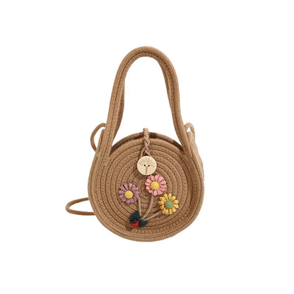 Round woven handbag with flower decoration – Tan flower bag on white background | BTendance