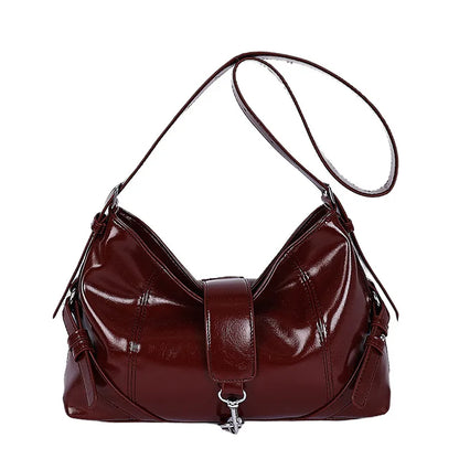 Glossy shoulder bag with central strap and metal clip — burgundy on white background | BTendance