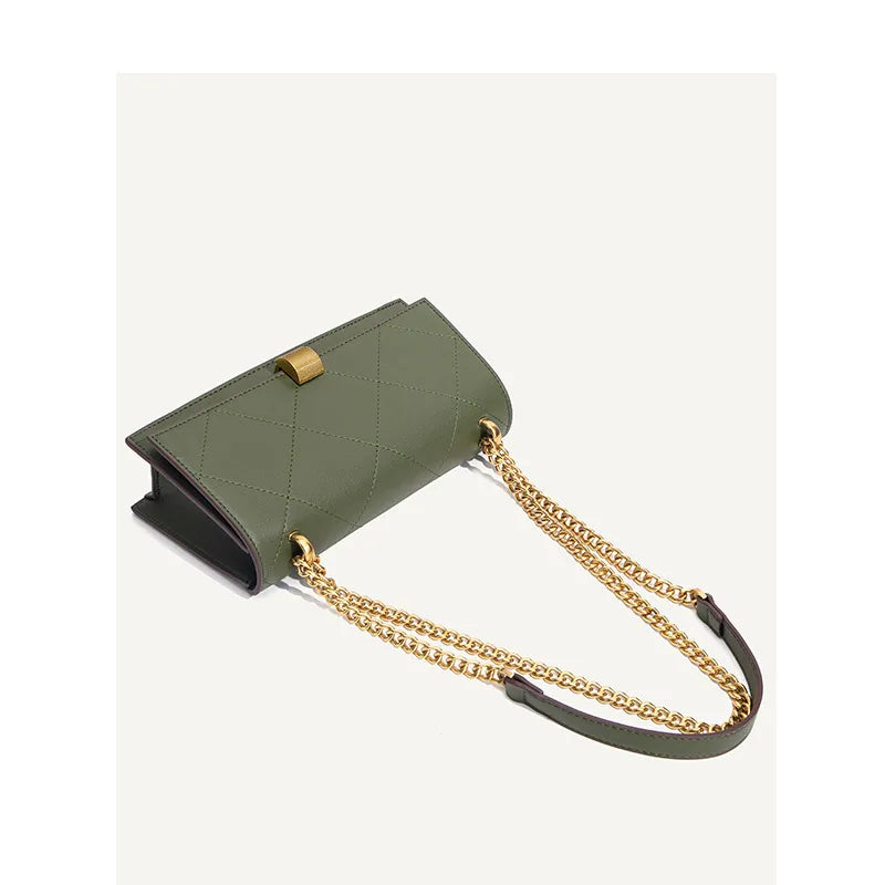 Geometric stitched chain shoulder bag – Olive green bag laid flat with chain strap | BTendance