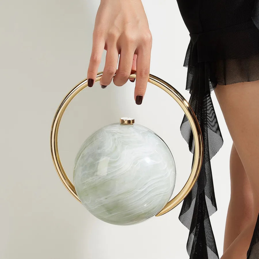Marbled Globe Evening Bag with Orbit Handle – Green carried by handle | BTendance