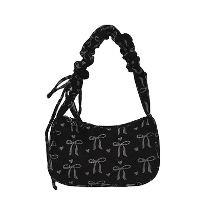 Bow-print corduroy shoulder bag with gathered handle — black front view on white background | BTendance