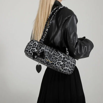 Leopard print shoulder bag with heart charm – Grey leopard bag worn with a black jacket | BTendance