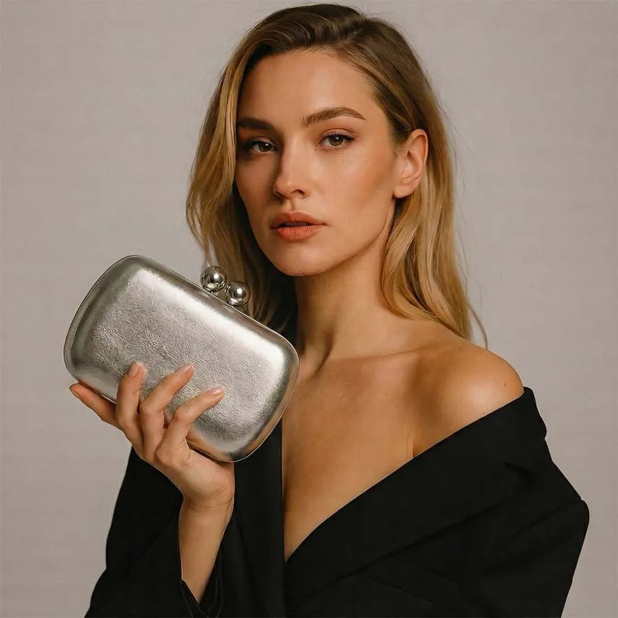Women's Kiss-Lock Faux Leather Evening Clutch – Silver held for scale | BTendance
