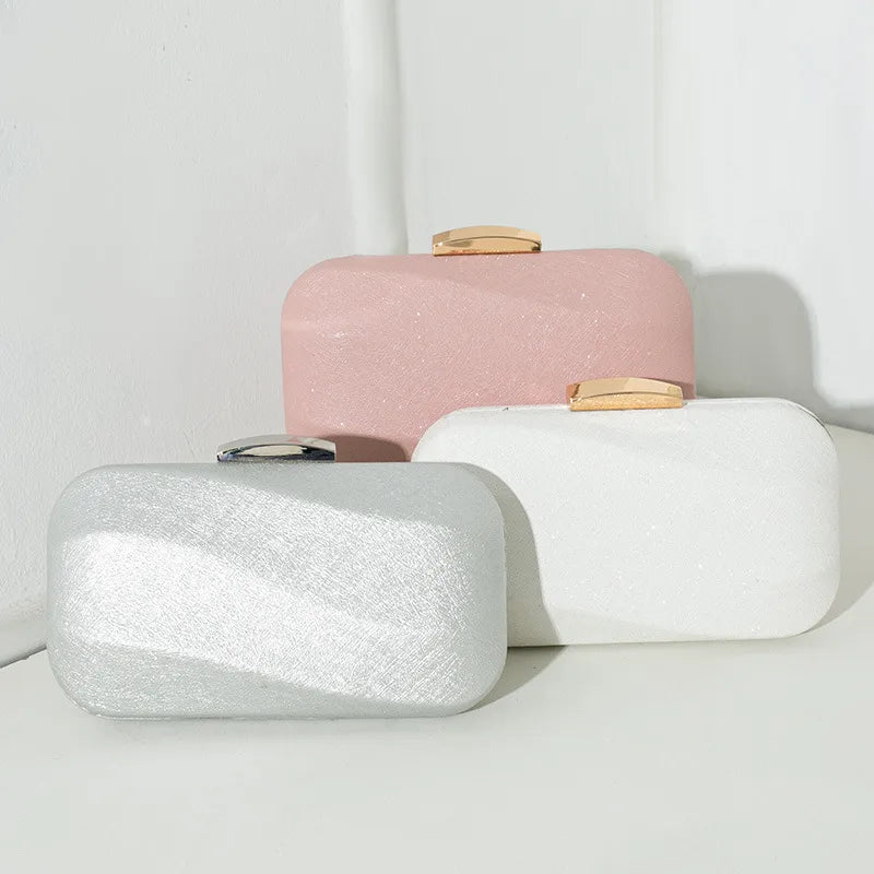 Rounded rectangular evening clutch with metal clasp — silver white and pink grouped together | BTendance