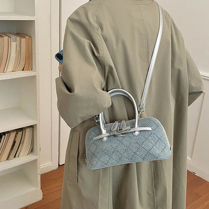 Denim handbag with silver-tone handles and shoulder strap — diamond embellishments worn crossbody | BTendance