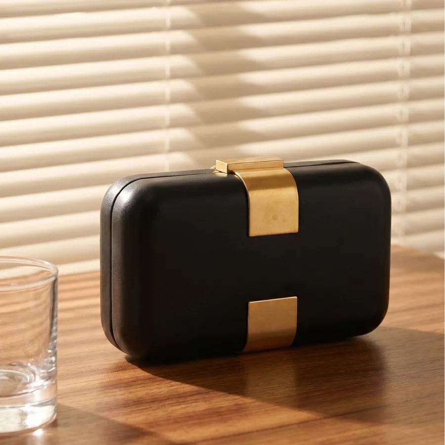 Rectangular evening clutch — black with gold-tone front accents | BTendance