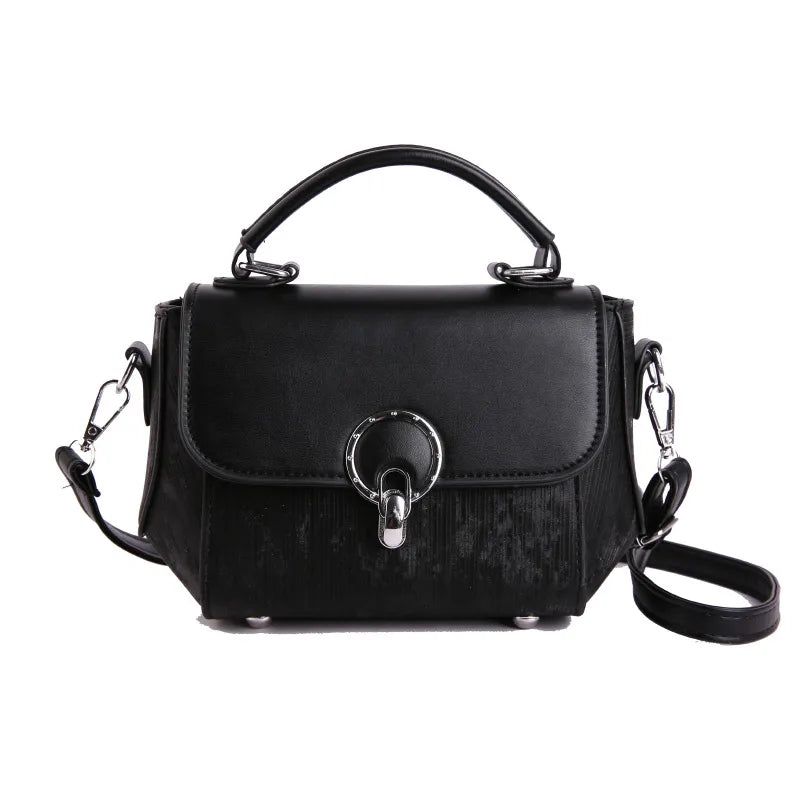 Ring clasp top handle crossbody bag – Black bag with shoulder strap, front view | BTendance